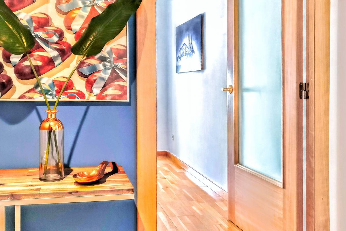 entrance with sleek design and painted in blue at the Dandelion apartment for rent for months in Barcelona with Terrace Luxury close to Diagonal Avenue