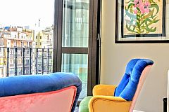 the Dandi luxury apartment for rent in Barcelona also boasts a glass gallery in the master bedroom that can be opened becoming a terrace