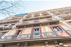 building façade of this apartment in Barcelona, located in the modernist Catalan neighbourhood of Eixample right district