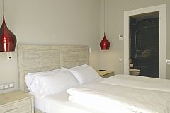 in this beautiful master bedroom at the Ferran Batik apartment you may dream about all things to do in Barcelona