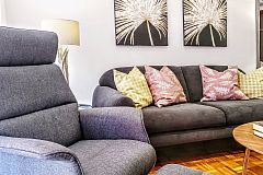 the comfortable armchair in the living area could be a nice place to review your daily  email, the fast fiber optic internet connection with wifi allows you to be connected in this Barcelona Technology Hub