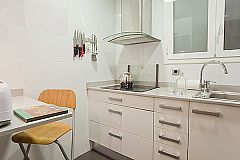 well-equipped kitchen with lots of storage space and a sweet dining corner for a quick morning coffee