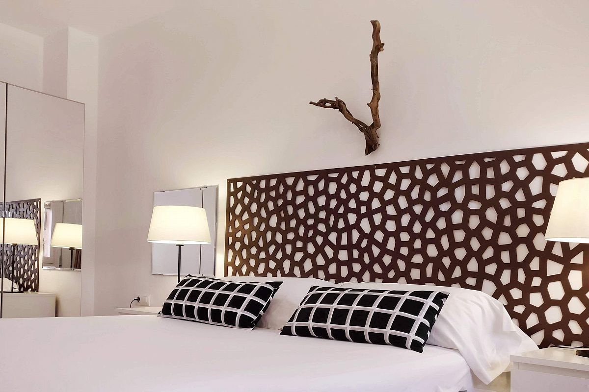 get yourself settled in the pristine white bed linen of the main bedroom of the Graden House property for rent in Barcelona