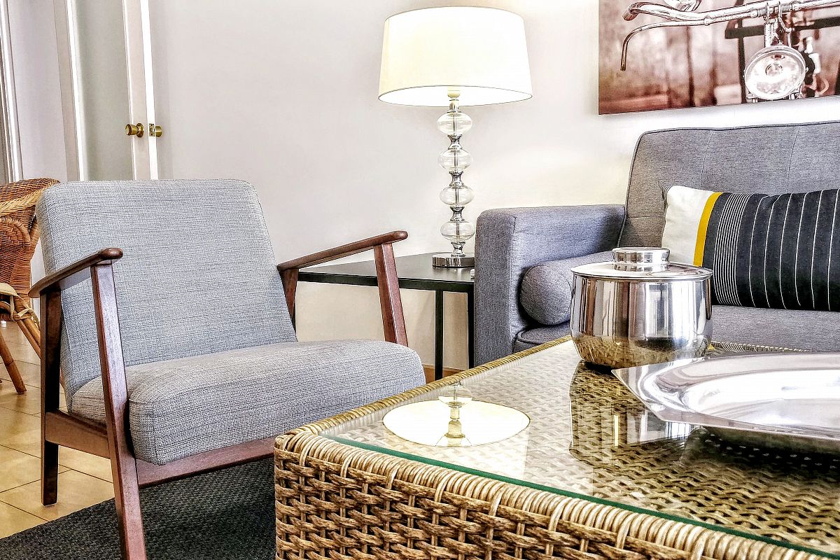 the living area with this comfortable pair of armchairs next to the sofa at the Garden House apartment is very convenient for family trips to Barcelona during your short term rental stay