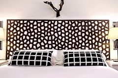 dramatic headboard detail fitting to perfection the bed cushions 