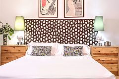 detail of the third bedroom headboard and side bed tables and lamps in the Garden House apartment for rent in Barcelona close to Sagrada Familia
