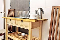 this convenient console table in the kitchen, according to your needs, may be a small occasional table or an auxiliar part of the kitchen countertop