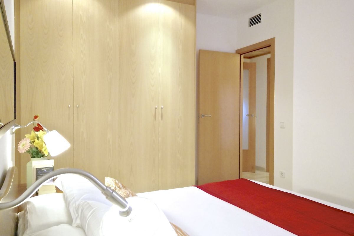 the master bedroom boasts a large closet for all the storage needs that you may need when visiting Barcelona