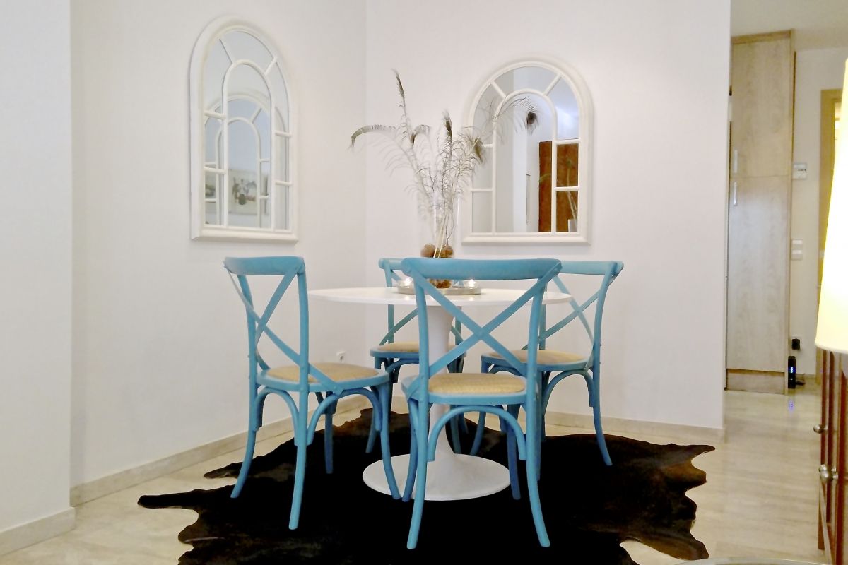 dining area dressed in blue in this Neo apartment family friendly 2BR and sunny Terrace in Eixample