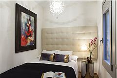 bedroom 3 with a double bed size 135x200 cm and with a large headboard covered in tufted white fabric