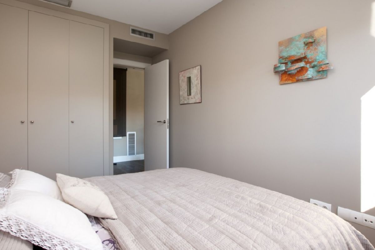 the second bedroom has its own lacquer doors closet and also enjoys a second bathroom with a shower cabin
