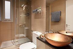 second bathroom with shower cabin and designer washbasin