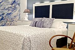 detail of the beautiful and original white and blue headboard with design lighting with leds 
