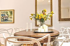 sit on the six Curve dining chairs by Kartell, the latest avant-garde design trend in this apartment rental in Barcelona La Rambla