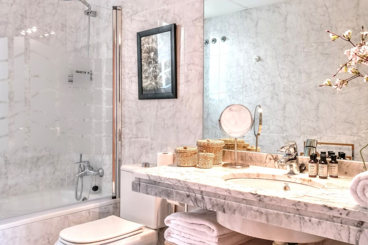 master ensuite bathroom in white marble with bathtub
