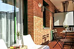 furnished terrace with a view to the city in this Dandelion apartment with terrace in Barcelona for monthly stays
