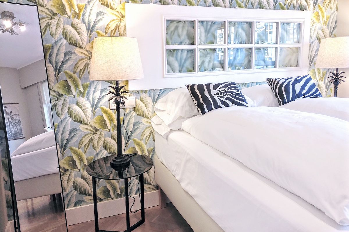 in this double bedroom of the Gatsby vacation rental in Barcelona the power of zebras and green leaves will elevate your spirit