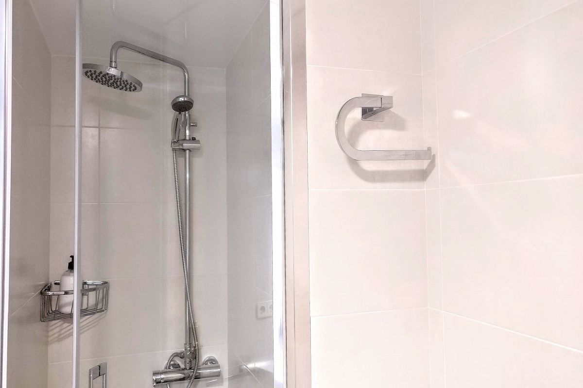 large shower cabin with rain effect head and handheld device will make you not want to leave for hours.