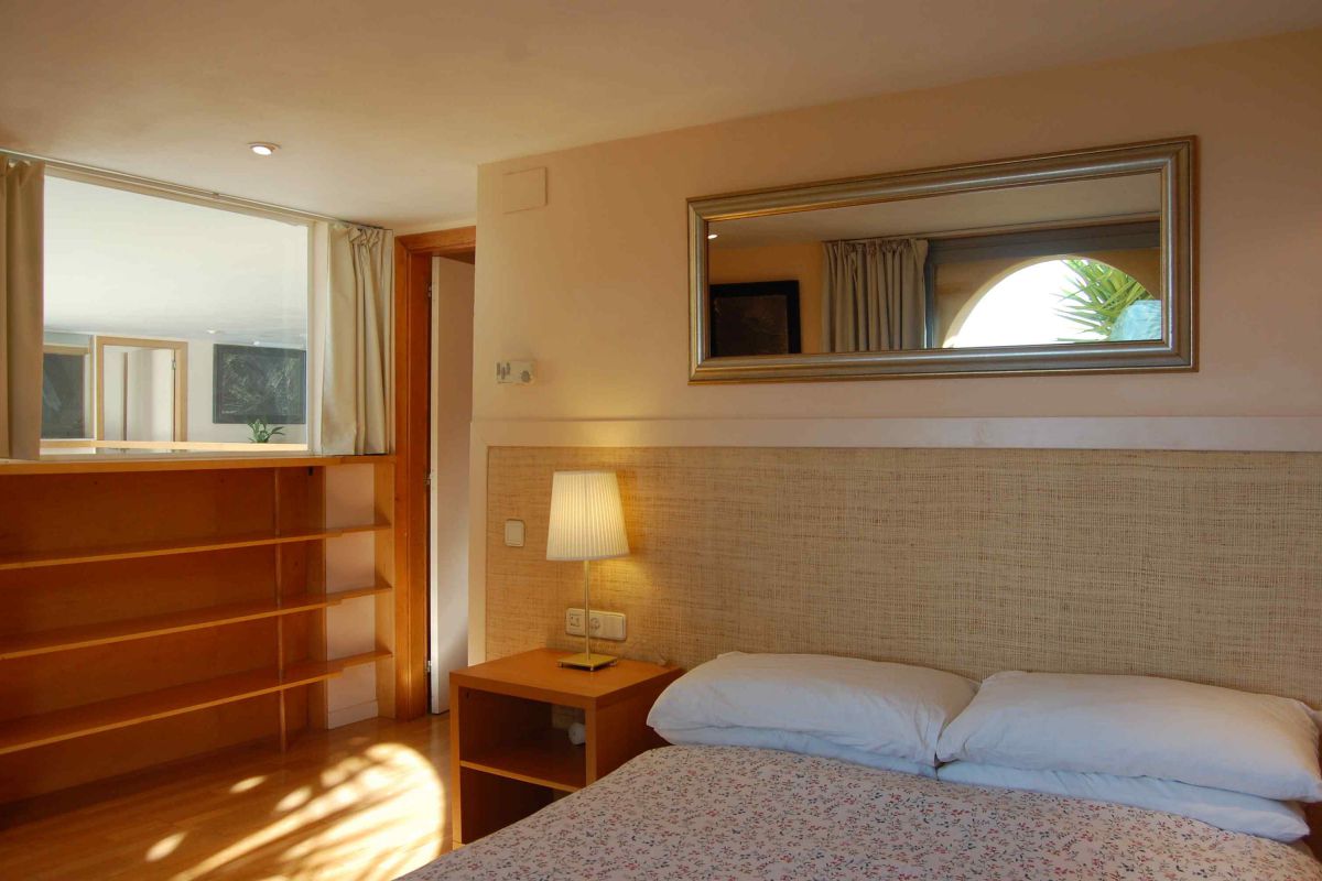 bedroom with working space in this luxury rental in Barcelona Sitges