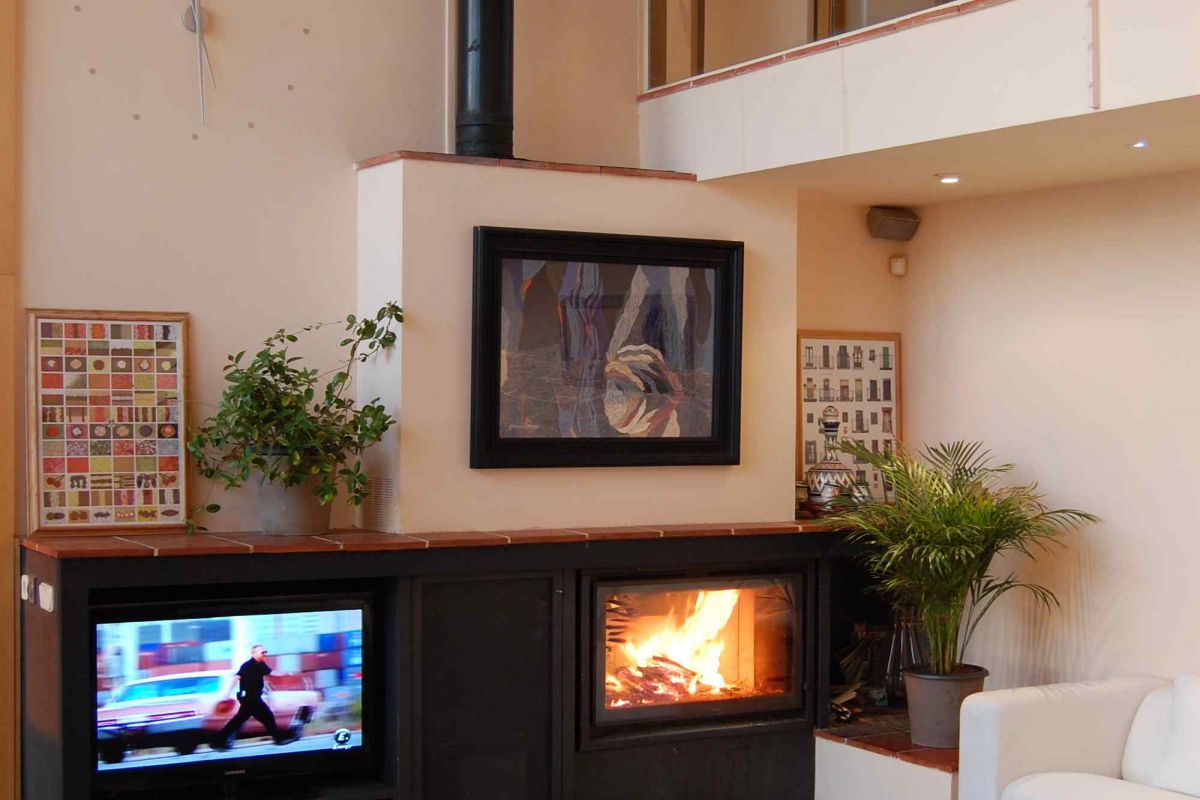 It is fully equipped also with fireplace and it has large windows looking into the private garden