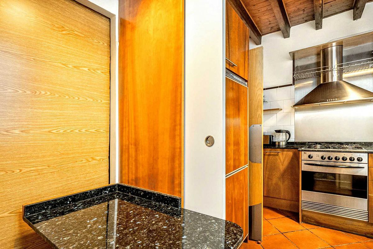 the sliding door closes and the privacy for both the bedroom and the kitchen is complete